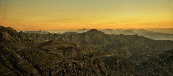 Scenic view of mountains at sunset