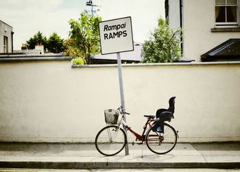 Bicycle parked in front of building