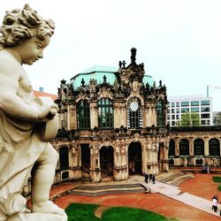 Statue of historic building against sky