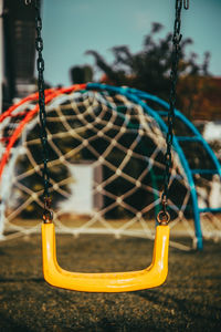 Close-up of swing in playground