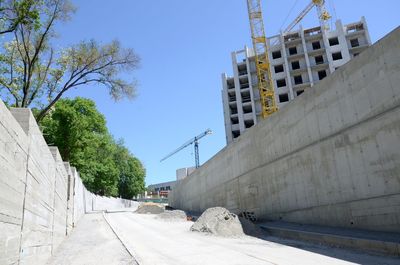 Low angle view of construction site against sky