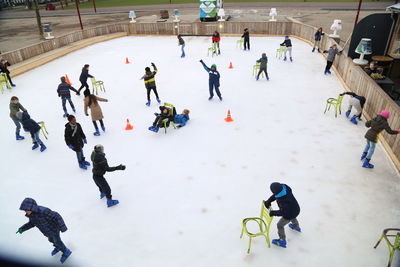 High angle view of people playing in snow