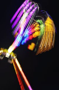 Low angle view of light trails at night