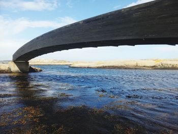 Bridge over sea against sky