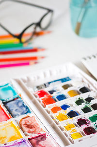 Close-up of color pallet on table