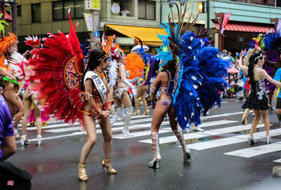 People dancing on street during festival