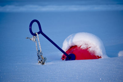 Boat harbor with snow and just buoys.