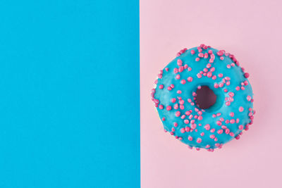 Directly above shot of multi colored candies against blue background