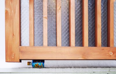 Close-up of wooden floor against wall at home