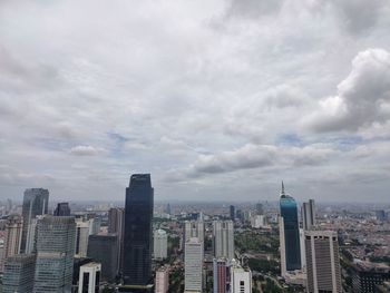 Modern buildings in city against sky