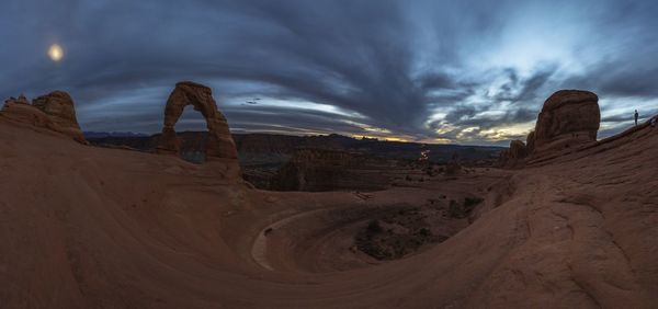 Panoramic view of landscape against cloudy sky