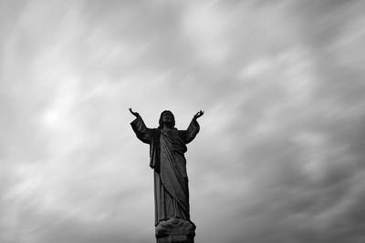 Low angle view of statue against sky