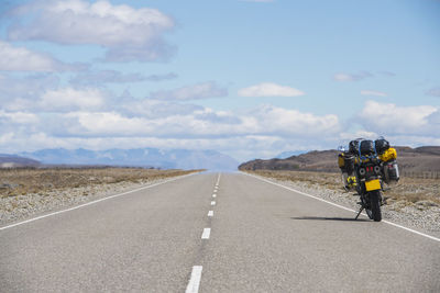 Adventure motorcycle parked at the side of highway in argentina