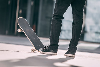 Low section of man skateboarding