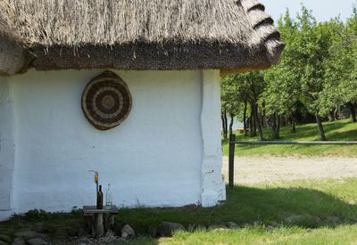 Old house on field by building