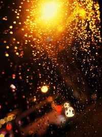 Close-up of wet glass window during rainy season