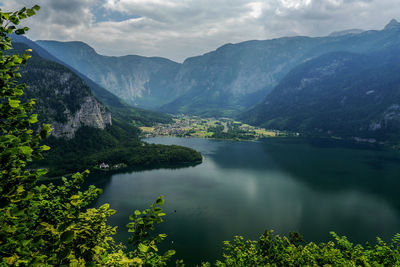 Scenic view of lake and mountains against sky