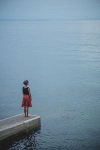 Woman standing in sea