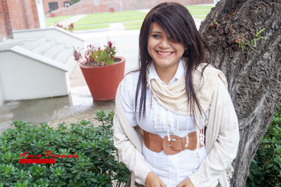 Portrait of young woman standing outdoors