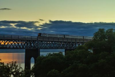 Bridge against sky at sunset