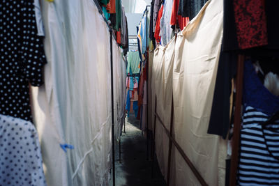 Row of clothes hanging in store