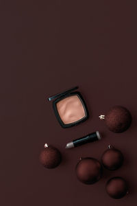 High angle view of beauty products against black background