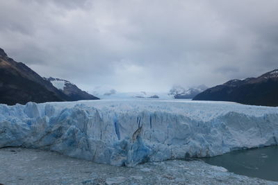 Scenic view of frozen lake against sky