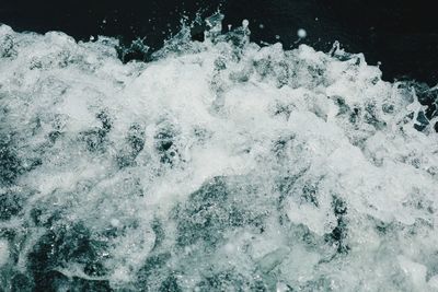 High angle view of water splashing in sea