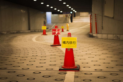 Row of traffic cones in parking area