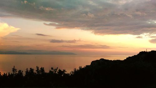 Scenic view of sea against cloudy sky