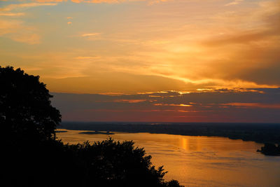 Scenic view of sea against romantic sky at sunset