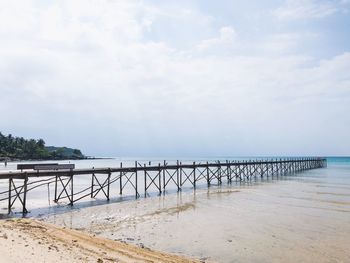 Pier over sea against sky