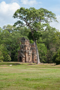 Old ruin on field against sky