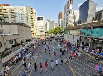 High angle view of people walking on city street