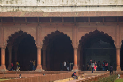 Group of people in front of historical building