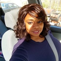 Portrait of smiling woman in car