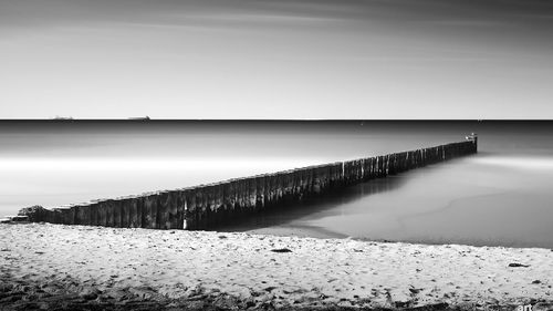 View of calm beach against sky