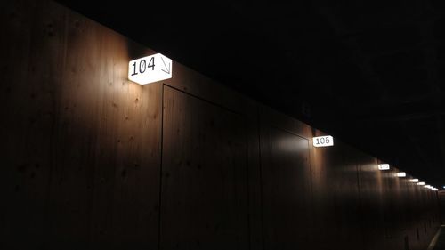 Illuminated sign on wall