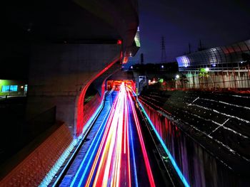 Light trails on illuminated city at night