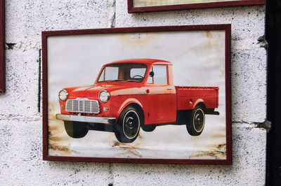 Close-up of toy car against building