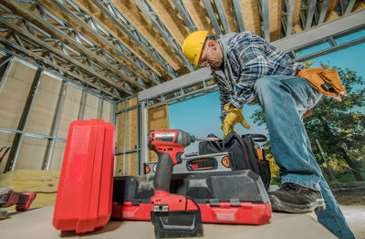 Rear view of man working in workshop