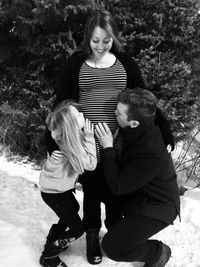 Full length portrait of happy siblings