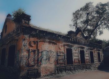 Low angle view of old building against sky