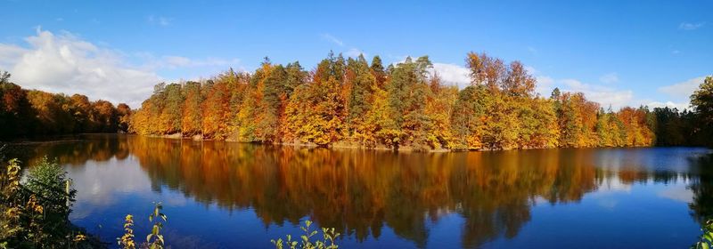 Scenic view of lake against sky during autumn