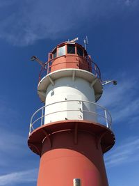 Low angle view of lighthouse against blue sky - warnemünde germany