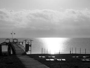 Pier over sea against sky