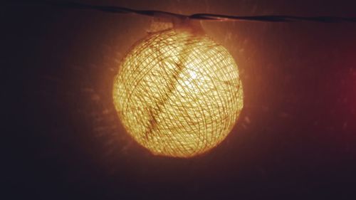Close-up of illuminated electric lamp