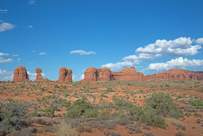 View of rock formations on landscape against sky