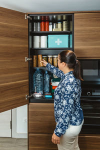 Portrait of smiling young woman sitting on table