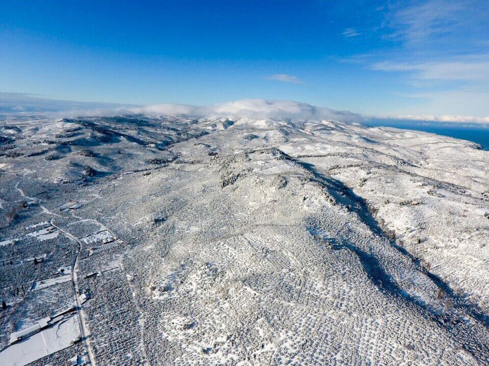 nature, snow, beauty in nature, cold temperature, winter, scenics, sky, tranquility, landscape, tranquil scene, day, non-urban scene, outdoors, aerial view, cloud - sky, no people, mountain